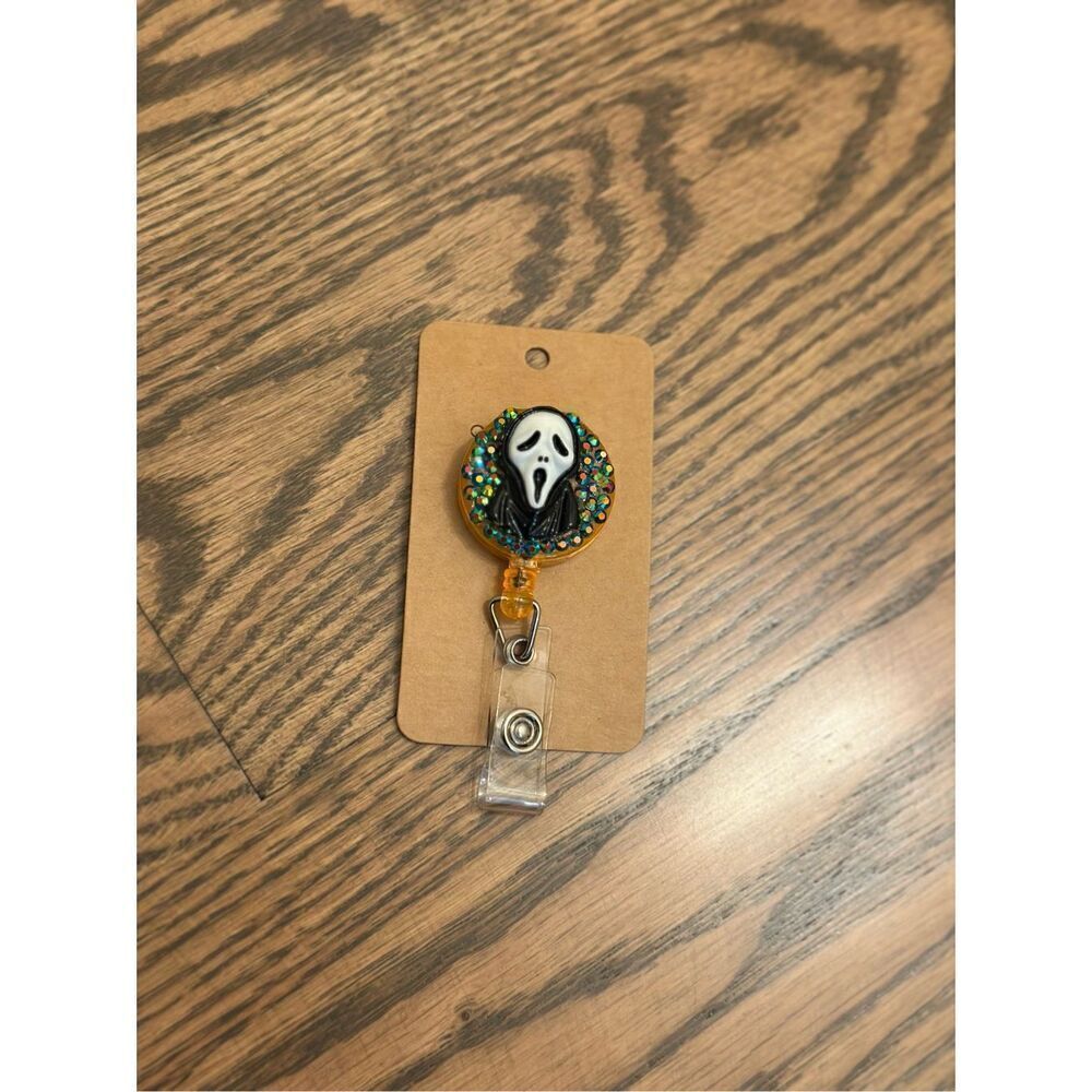 Scream Horror Ghost Face Orange and Rhinestone WORK badge Reel